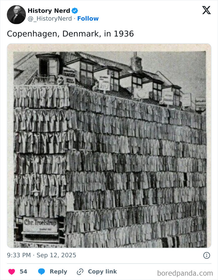 Black and white historic photo showing rows of clothing drying on a building facade in Copenhagen in 1936, exploring history.