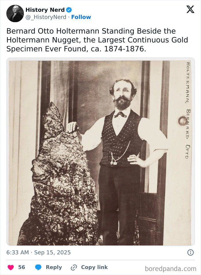 Bernard Otto Holtermann standing beside the largest continuous gold specimen ever found in a historic rare photo.