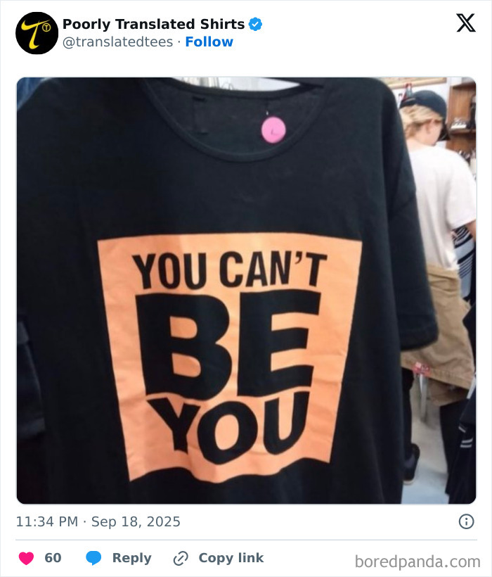 Black t-shirt with a funny poorly translated English phrase, an example of ridiculous English T-shirts worldwide.