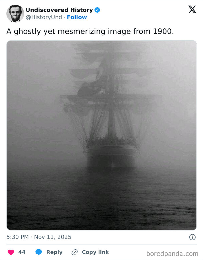 Ghostly black and white photo of an old sailing ship enveloped in fog, revealing a moment lost to time.