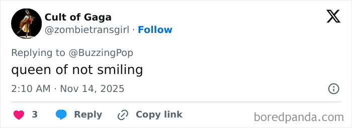 Millie Bobby Brown wearing lingerie with a train on the Stranger Things red carpet, posing confidently at the event.