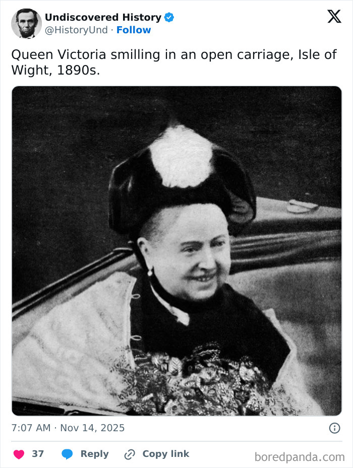 Queen Victoria smiling in an open carriage on Isle of Wight, a fascinating photo revealing moments lost to time.