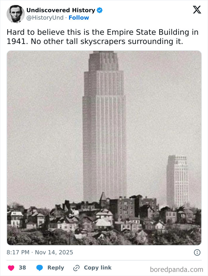 Black and white photo of the Empire State Building in 1941 with few skyscrapers around, revealing moments lost to time.