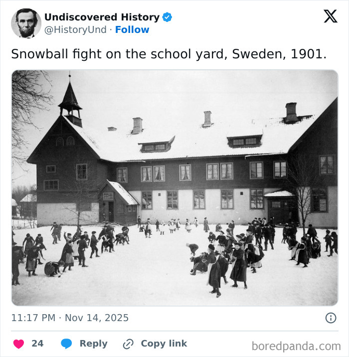 Black and white photo of children having a snowball fight in a school yard, capturing moments lost to time in 1901 Sweden.