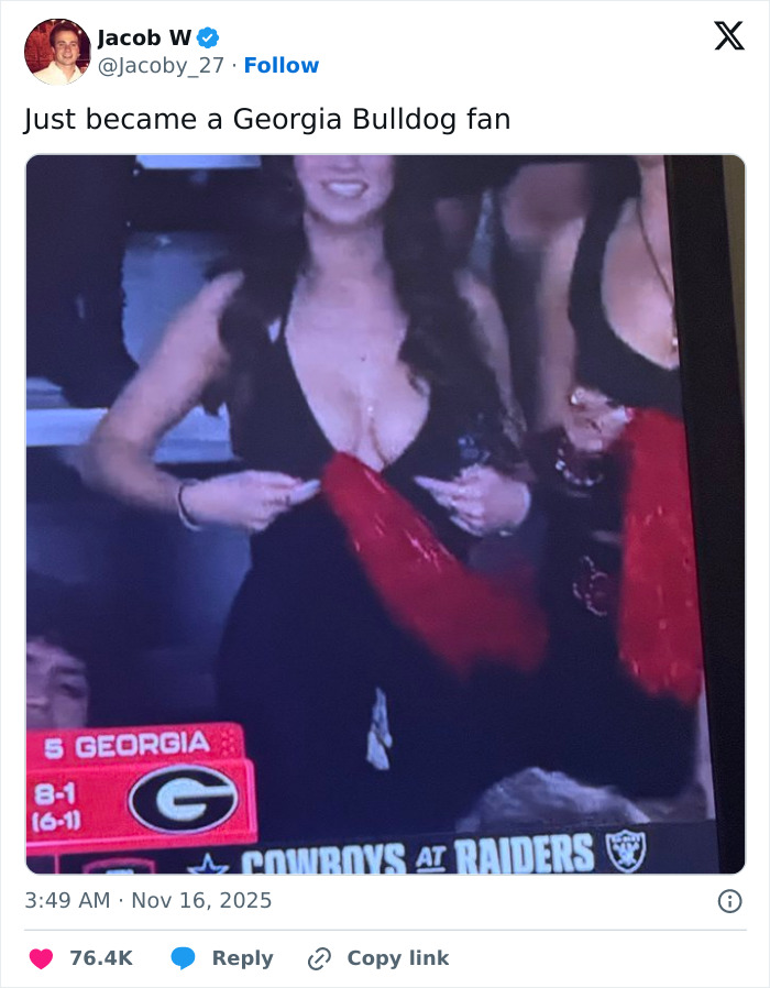 Stunning woman wearing black dress and red scarf at Georgia-Texas game, sparking wild reactions among fans in the crowd. Stunning woman wearing black dress and red scarf at Georgia-Texas game, sparking wild reactions among fans in the crowd.