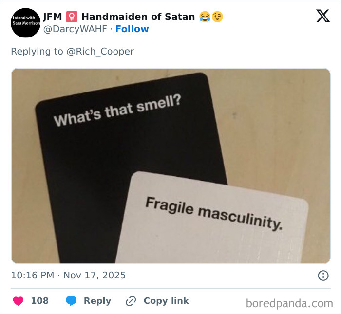 Two cards from a game read What’s that smell? and Fragile masculinity, highlighting internet roasting of man bashing woman’s PhD. Two cards from a game read What’s that smell? and Fragile masculinity, highlighting internet roasting of man bashing woman’s PhD.