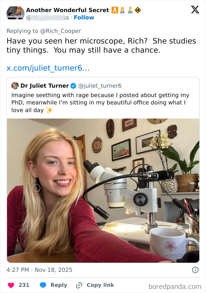 Woman with PhD smiling at microscope in her office, celebrating women’s success after internet roast of man’s criticism. Woman with PhD smiling at microscope in her office, celebrating women’s success after internet roast of man’s criticism.