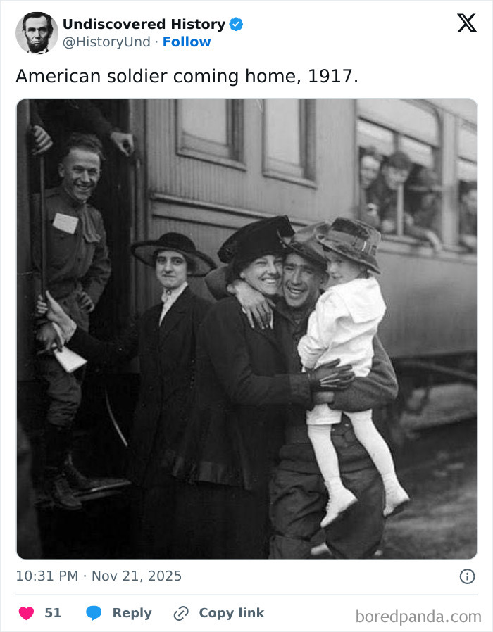 American soldier embraces family at train station, a poignant moment revealing history lost to time in 1917.