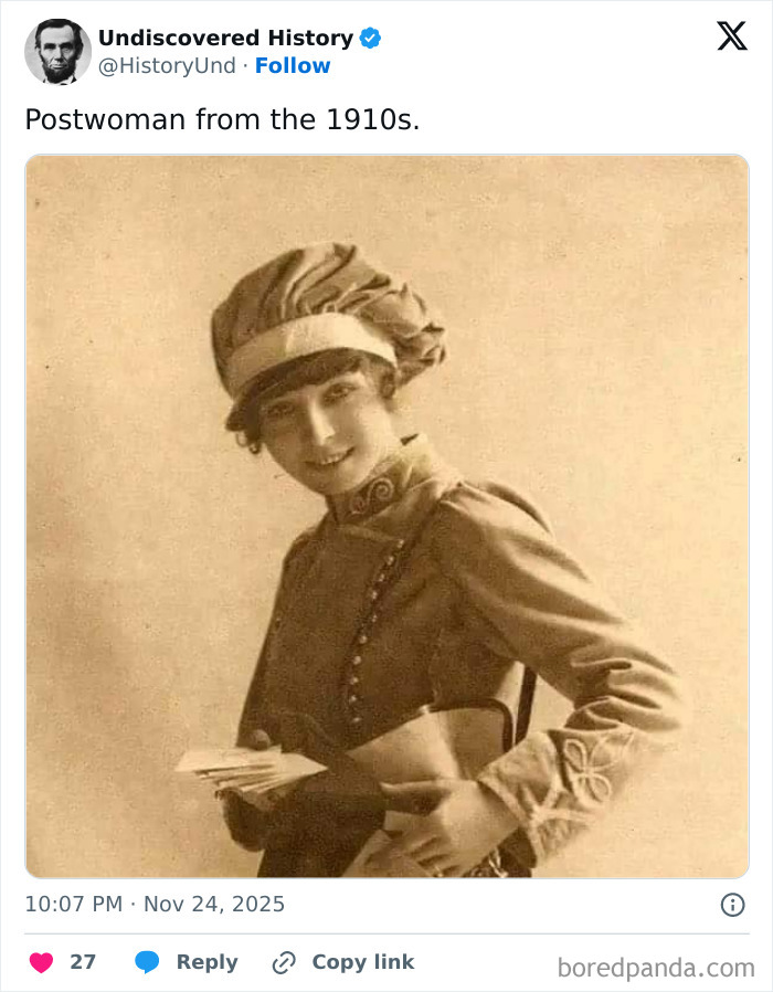 Postwoman from the 1910s holding letters, vintage black and white photo showcasing moments lost to time.