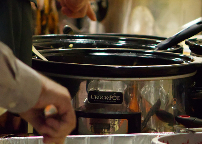Close-up of a crock-pot slow cooker among other kitchen items, illustrating horrible gifts people have actually received.