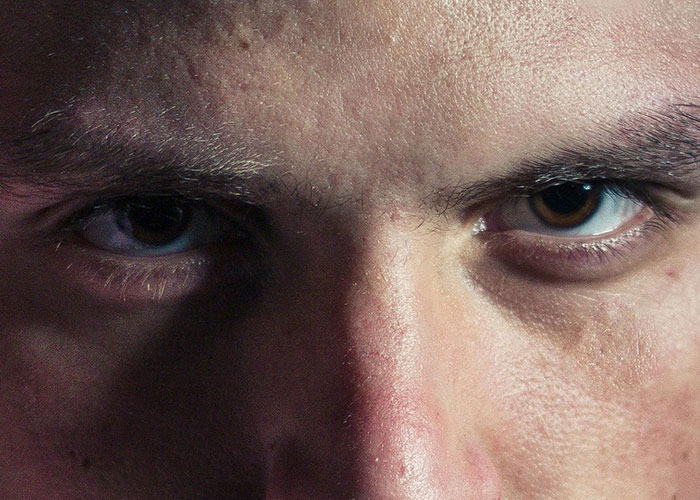 Close-up of intense eyes representing psychiatric institution workers experiencing unforgettable moments on the job.