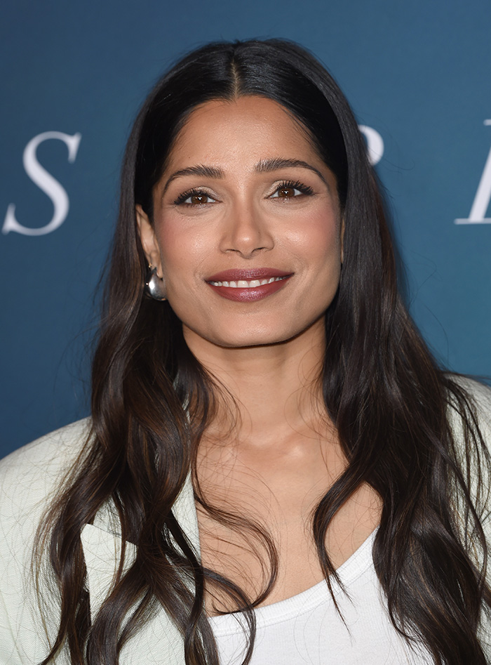 Close-up of a beautiful celebrity with long dark hair and natural makeup, exemplifying the golden ratio beauty standards. Close-up of a beautiful celebrity with long dark hair and natural makeup, exemplifying the golden ratio beauty standards.