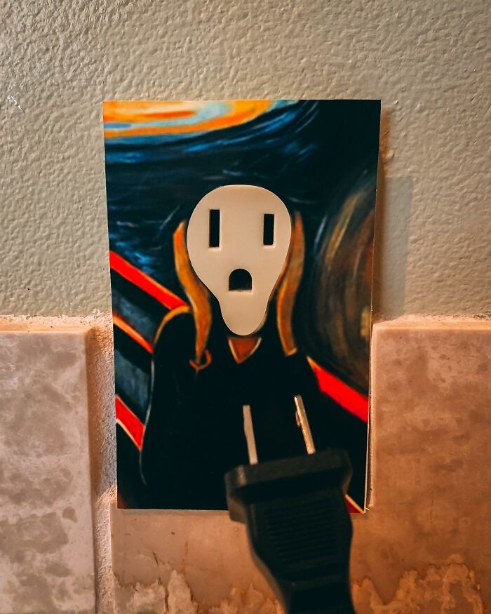 Paper cutouts by Rudy Willingham creatively blend with a plug and wall in a clever interactive art piece. Paper cutouts by Rudy Willingham creatively blend with a plug and wall in a clever interactive art piece.