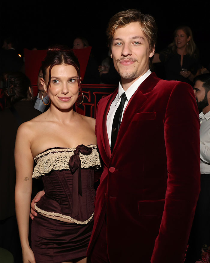 Millie Bobby Brown at event with companion, fans reacting to news of her legal name change in Hollywood setting Millie Bobby Brown at event with companion, fans reacting to news of her legal name change in Hollywood setting