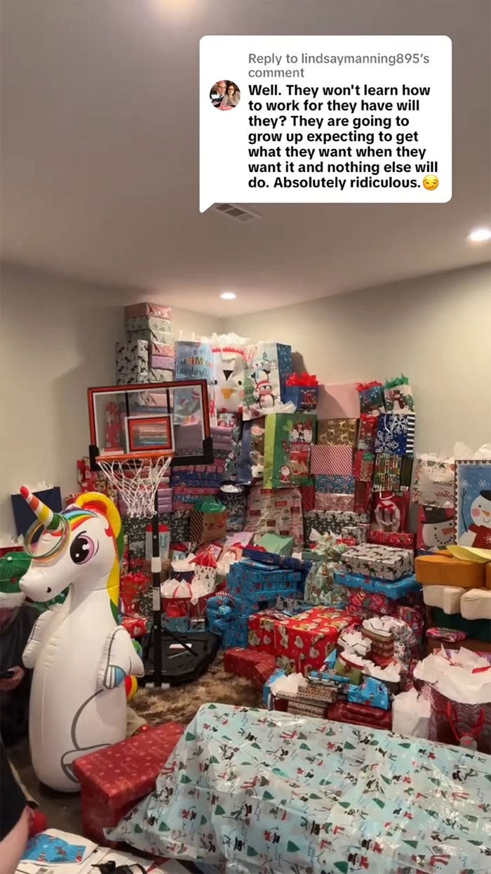 Room filled with an insane amount of gifts for kids, sparking backlash about consumerism and excessive presents.