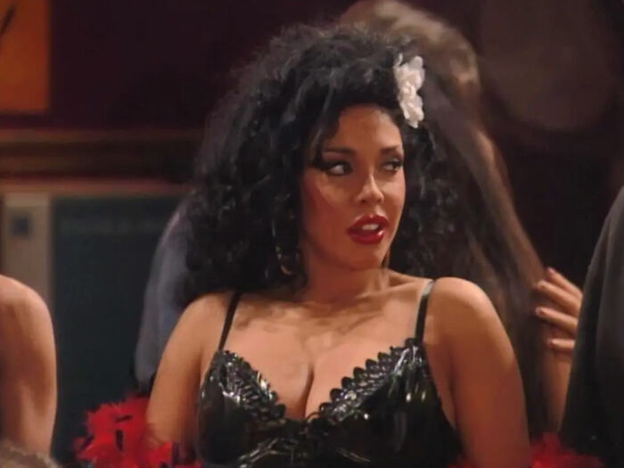 Actress in black dress with flower in hair, related to fake plastic surgeon and botched silicone injections case. Actress in black dress with flower in hair, related to fake plastic surgeon and botched silicone injections case.