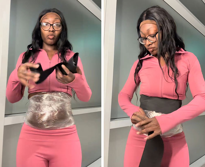 Woman demonstrating trick to hide loose skin on her belly after massive weight loss, wearing pink workout clothes indoors. Woman demonstrating trick to hide loose skin on her belly after massive weight loss, wearing pink workout clothes indoors.