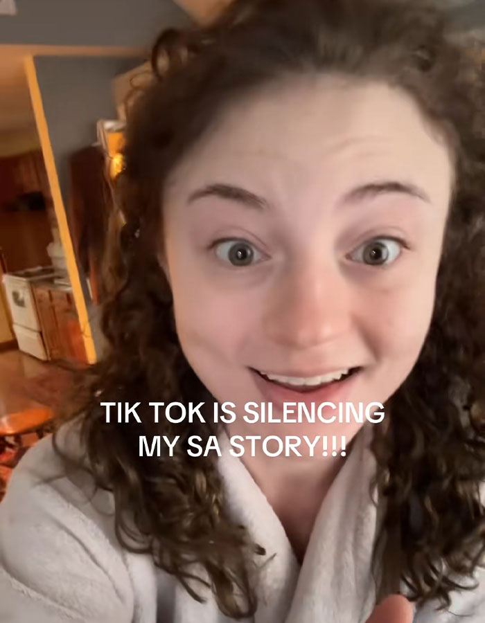 Person with curly hair in a home setting, expressing concern about DoorDash driver arrested after recording and posting video.