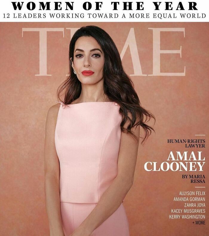 Amal Clooney on magazine cover wearing pink dress with styled hair and red lipstick in a polished portrait setting. Amal Clooney on magazine cover wearing pink dress with styled hair and red lipstick in a polished portrait setting.