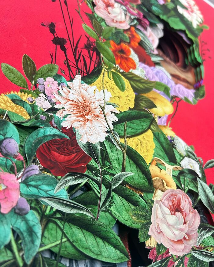 Intricate collage of a human silhouette made from vibrant flowers and leaves against a bold red background.