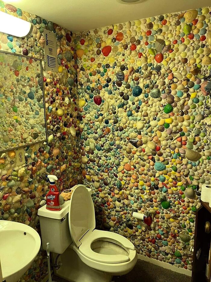 Bathroom walls covered with colorful shells in an unusual Zillow home you have to see to believe.