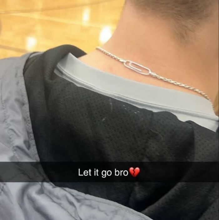 Close-up of a person wearing a silver chain necklace and black hoodie with caption about letting go, popular pics that go hard.