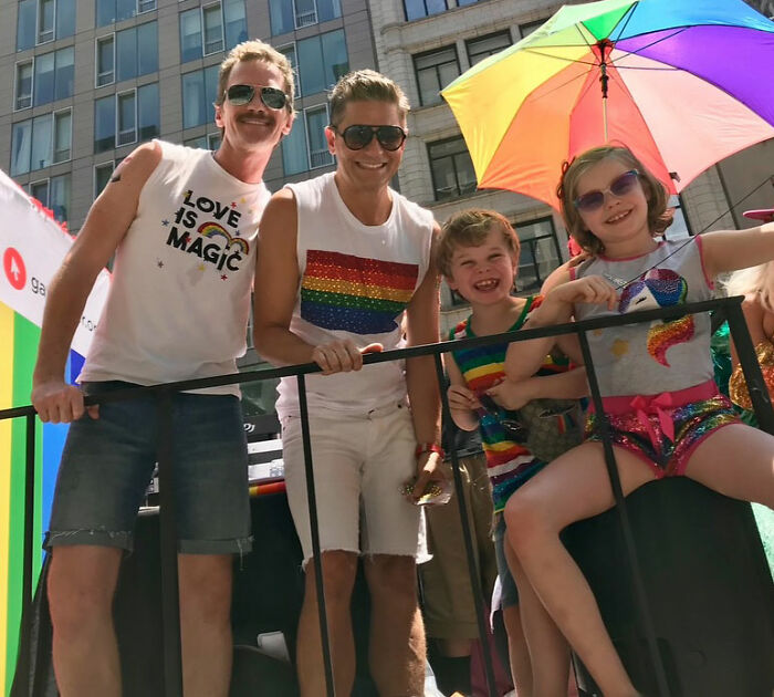 Neil Patrick Harris and family at outdoor event, with daughter Harper, 15, showing a grown-up look under a rainbow umbrella. Neil Patrick Harris and family at outdoor event, with daughter Harper, 15, showing a grown-up look under a rainbow umbrella.
