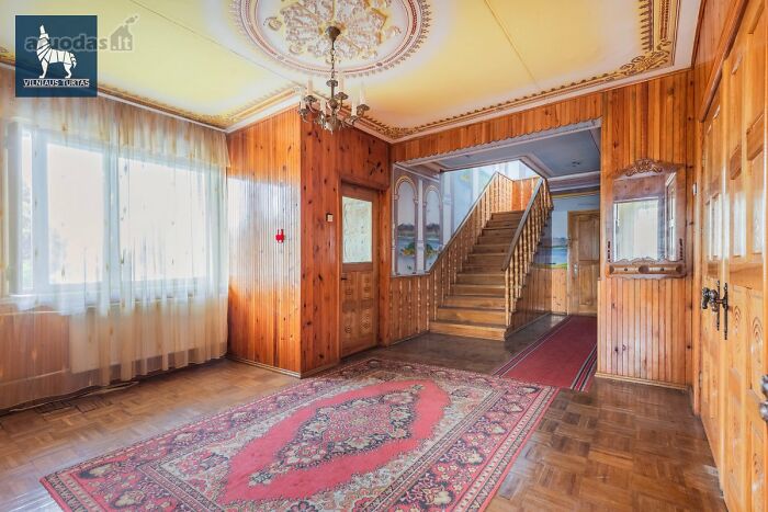 Spacious wooden interior in a vintage home featured in wild real estate listings to help sell properties.