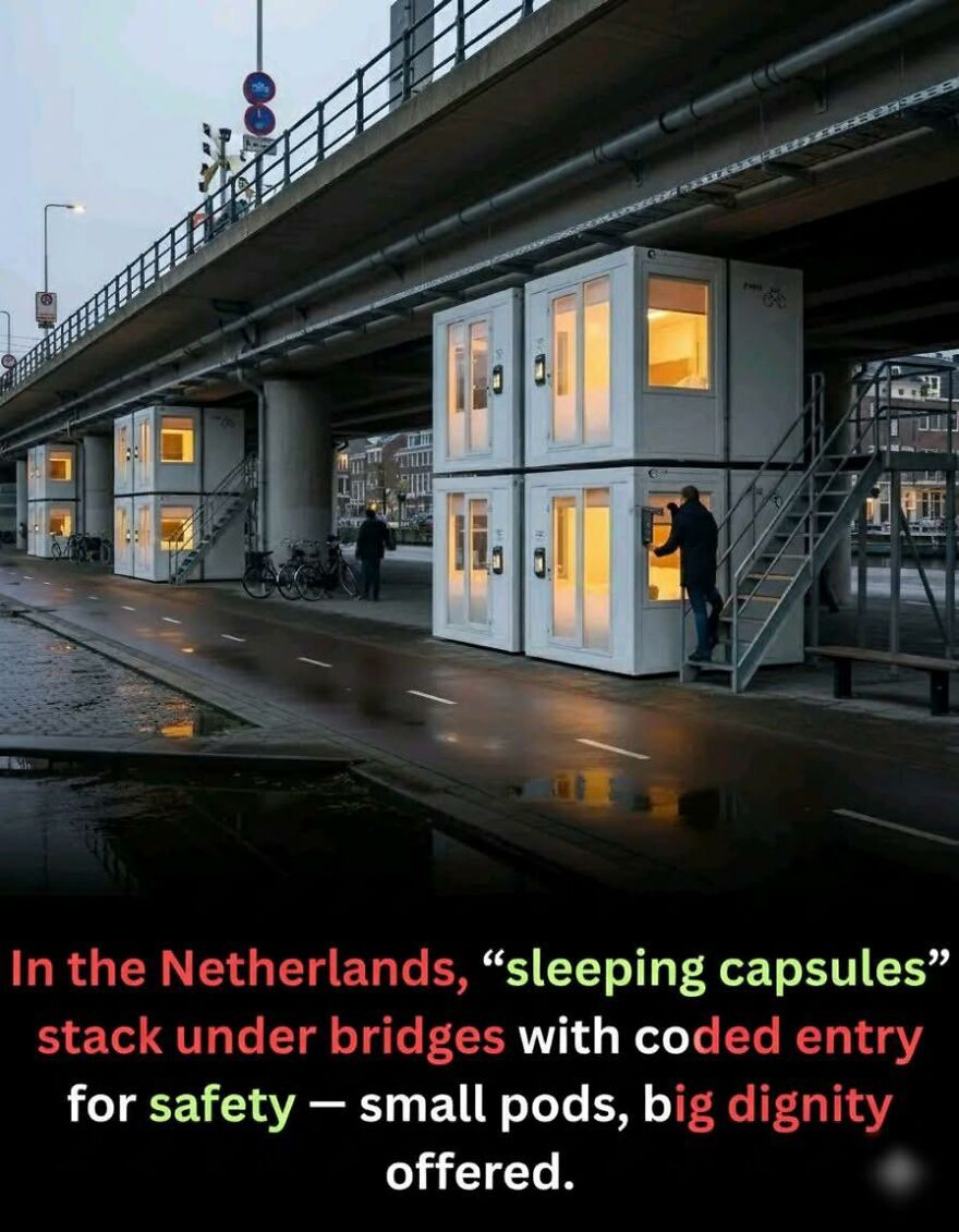 Sleeping capsules stacked under a bridge in the Netherlands, offering safe and innovative small pods for rest and dignity.