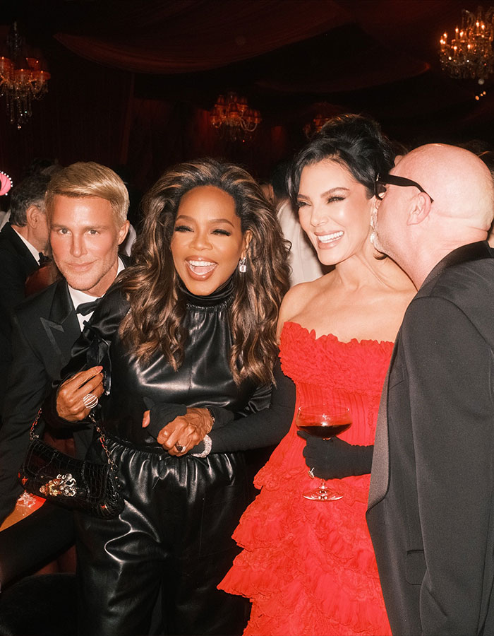 Guests at Kris Jenner's 70th birthday bash smiling and enjoying the glamorous party atmosphere in elegant attire. Guests at Kris Jenner's 70th birthday bash smiling and enjoying the glamorous party atmosphere in elegant attire.