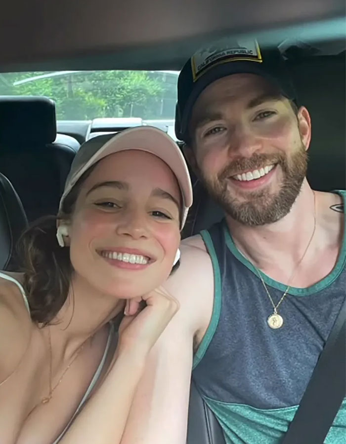 Chris Evans smiling with a woman in a car, linked to cheating rumors amid viral scandalous blind items.