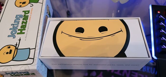 Joking Hazard card game box with a smiling face design, one of the 20 gifts for early holiday shopping satisfaction.