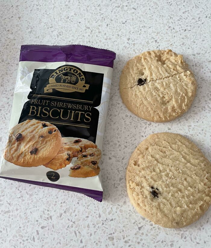 Packaging for fruit Shrewsbury biscuits shows multiple pieces, but only two small biscuits are outside the bag illustrating misleading packaging.