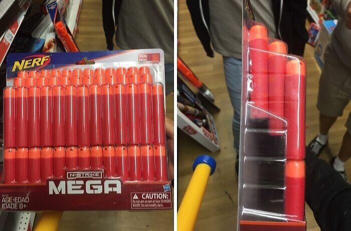Nerf Mega darts package showing misleading packaging with fewer darts visible from side view in retail store.