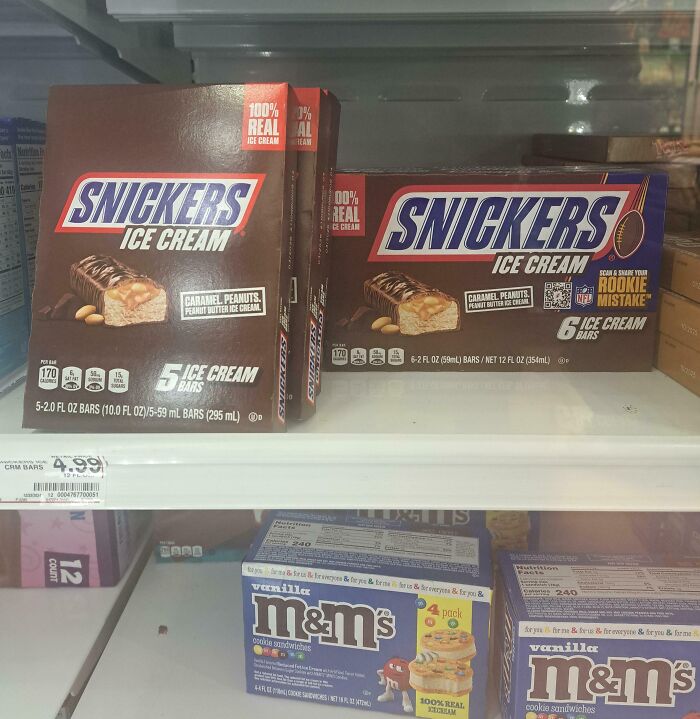 Snickers ice cream bars in misleading packaging showing 5 bars versus 6 bars in the same-sized box on a store shelf.
