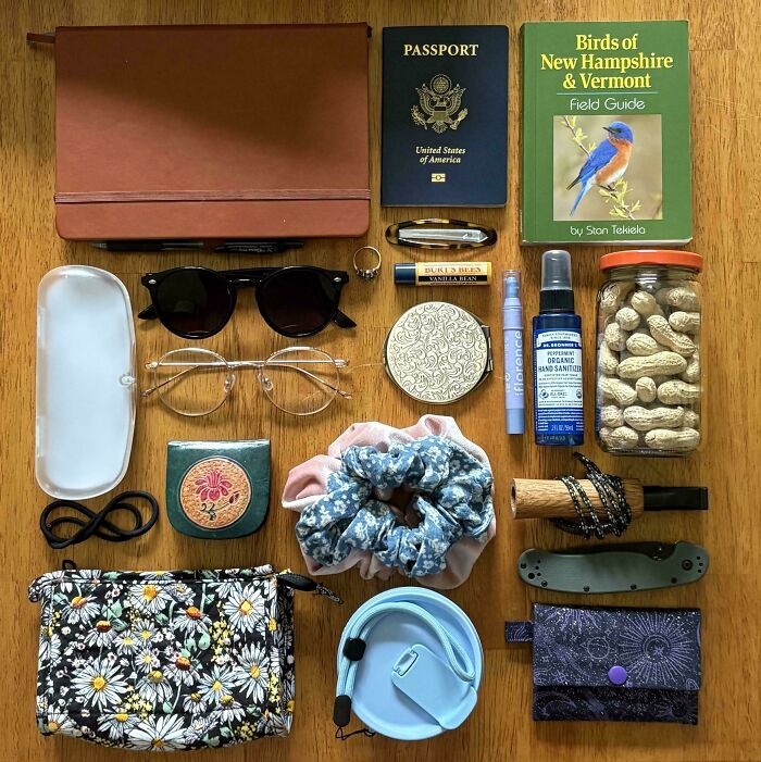 Neatly knolled everyday items on a wooden surface, showcasing order and organization for visual satisfaction.