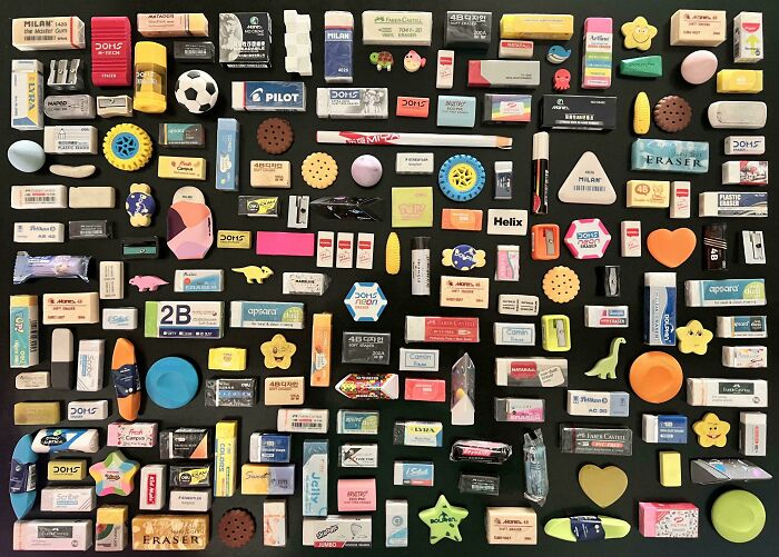 Various colorful erasers and small objects neatly arranged in an orderly grid satisfying the need for order and knolled design.