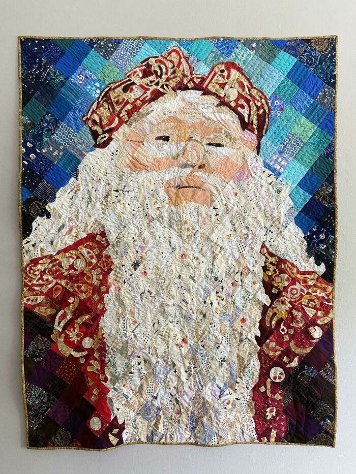 Quilted textile portrait of a bearded man wearing an ornate red hat, showcasing creative people and cool projects.