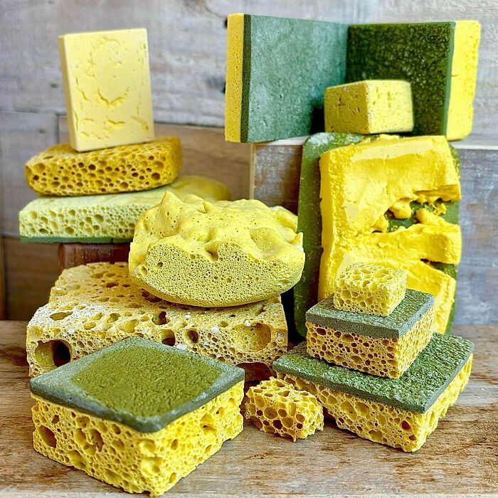Colorful creative sponges stacked in various shapes and sizes, showcasing unique texture in an artistic project.