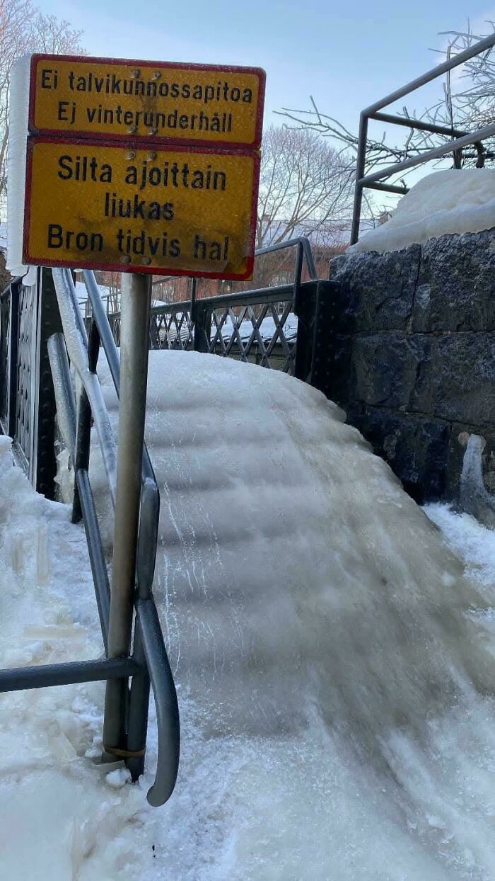Icy stairs covered in snow and ice with a warning sign, illustrating Airbnb insanity and the need for insurance.