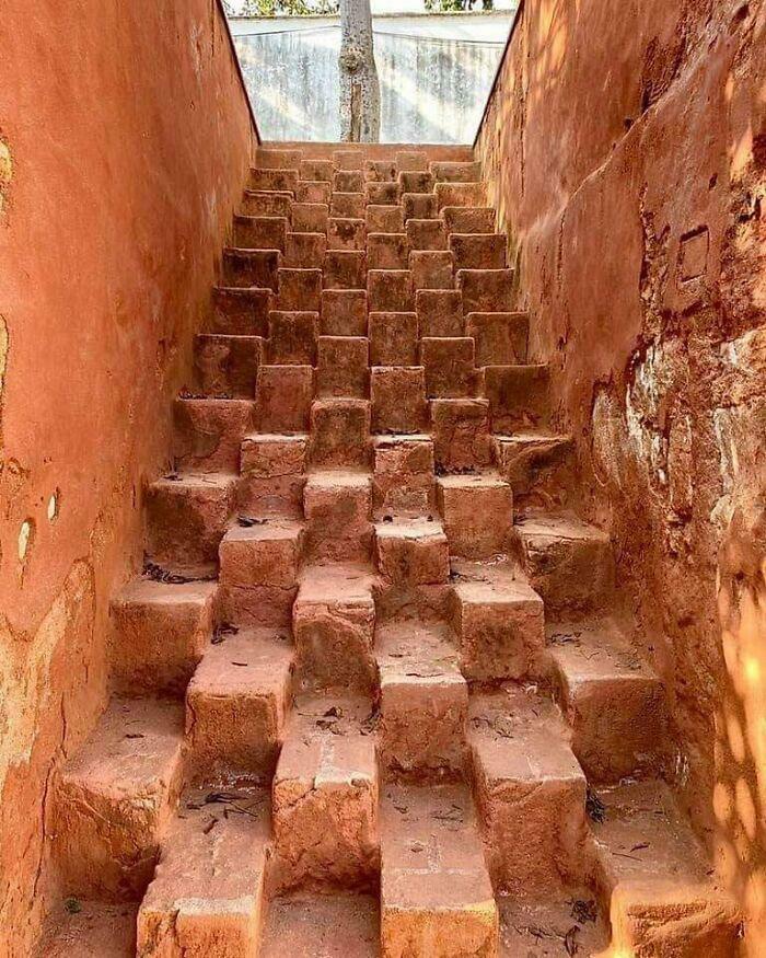 Uneven and unusual stone stairs with multiple narrow steps, illustrating Airbnb insanity stair hazards needing insurance precautions.