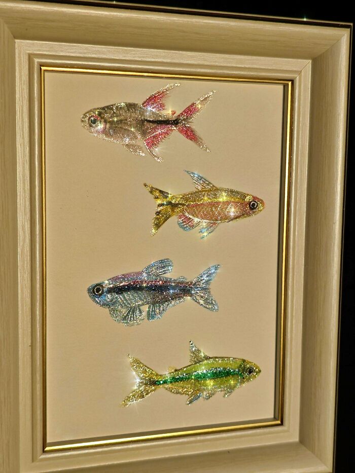 Glittering fish art framed on wall showcasing creative projects highlighting unique artistic expression.