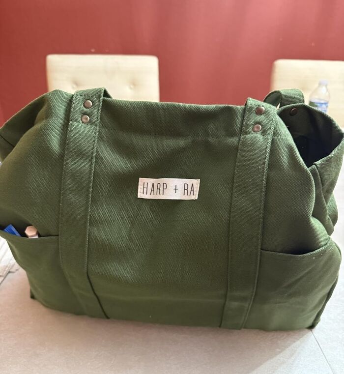 Green canvas tote bag with side pockets, ideal foolproof find for people who are impossible to shop for gifts.