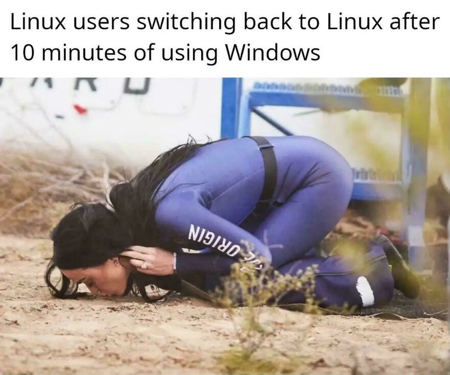 Person in blue jumpsuit lying face down on dirt, illustrating funny programming memes about debugging struggles with Linux and Windows users.