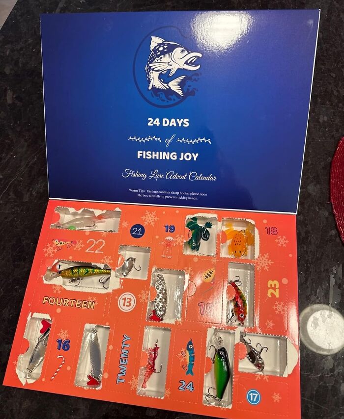 Fishing lure advent calendar with 24 days of fishing joy, featuring colorful lures behind numbered doors.