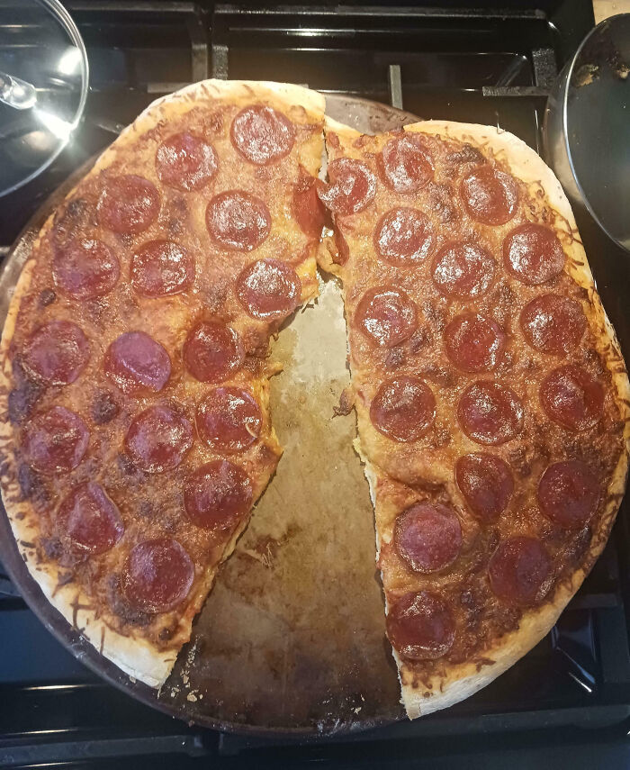 Partially eaten pepperoni pizza with one slice missing, illustrating family frustration moments shared online.