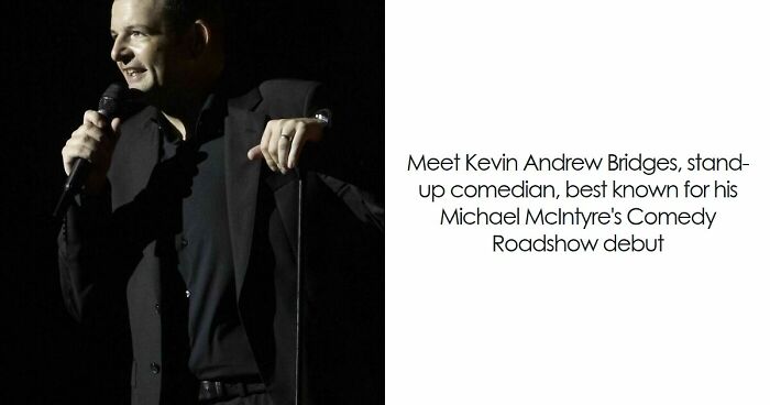 Kevin Bridges performing stand-up comedy on stage, holding a microphone and engaging the audience.