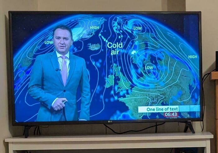 Weather presenter showing a forecast with cold air on the map, a funny example of people not even trying at their job.