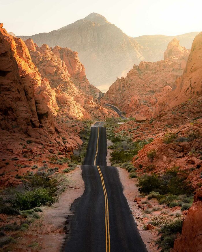 Winding road through rocky desert landscape captured in amazing pics showing our world from a different perspective.