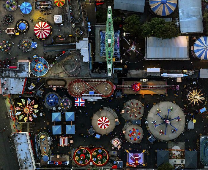 Aerial view of colorful amusement park rides and attractions showing our world from a completely different perspective.